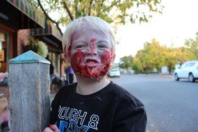 child with zombie make-up for halloween