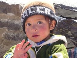 waving boy in peru