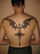 back of a man with a big black tattoo