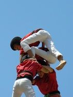 human tower against the sky