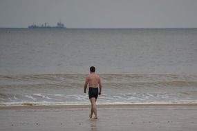 a man on the beach of the North Sea