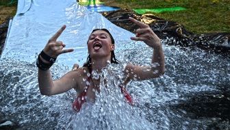 happy girl in a spray of water