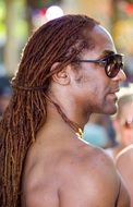 young man with dreadlocks in profile