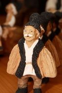 Figurines from clay of old men in Romanian traditional costume