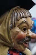 wooden mask of funny human face