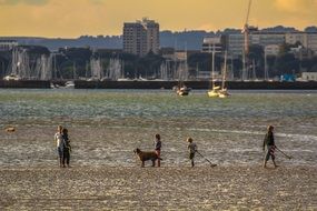 people on the background of low tide, England