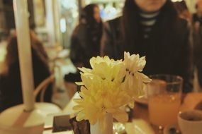 flowers in vase on table at restaurant