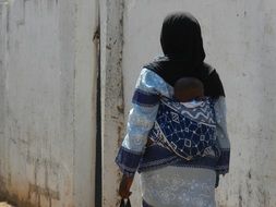 local woman with a child in the gambia