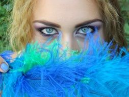 Girl with the blue and green feathers