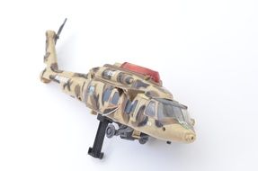trashed war helicopter, child toy