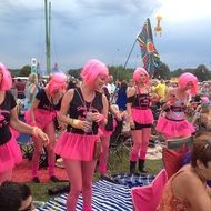 costumed girls in pink wigs at festival