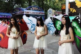 girls in butterfly costumes at the carnival