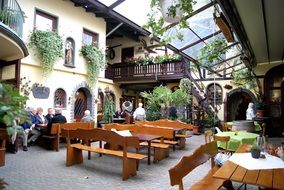 people are sitting at the dining tables in the cozy beer garden, germany, Koblenz