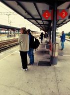people on the platform at the railway station