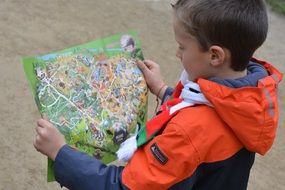 Child looking on a map