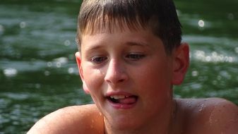 boy swimming in river