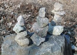 small stones in piles on big one