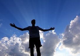 male silhouette in the sun