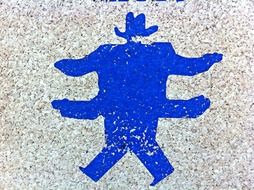man in hat and 4 hands drawing