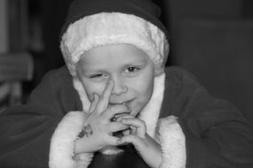 photo of a boy in a Christmas costume, black and white