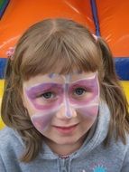 colorful make-up on the face of a child