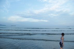 baby and sea waves