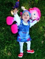 girl with a huge pink doll