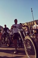 young people with bicycles in city at summer