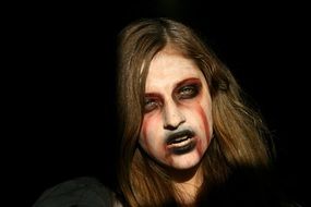 girl looks like a ghost for Halloween