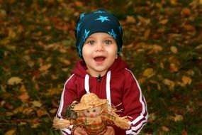 portrait of a child with a doll in the hands