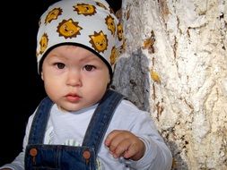 baby boy in a summer hat portrait
