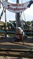 girl in the mouth of a toy shark slagharen
