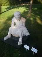 sculpture of a man with fish in the park