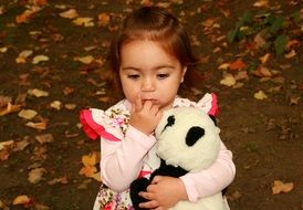 little girl in a dress with panda