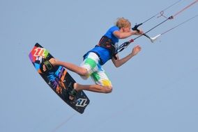 Kitesurfer is floating in the air