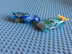 two children racing cars