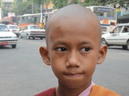 face of child believer in religion Buddhism