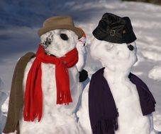 snow man couple winter wintry