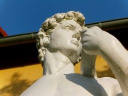 head of stone sculpture in the garden