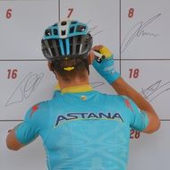 the cyclist puts the signature on the wall
