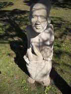 stone sculpture on green grass