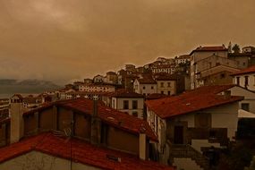 roofs of buildings on the background of clouds