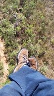 male legs in jeans and sneakers