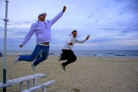 jumping men on the beach