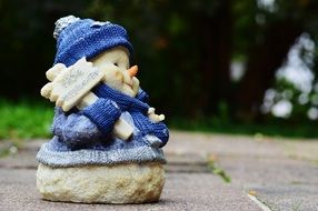 cute snowman figurine in the park