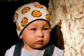 portrait of a child in a baby hat