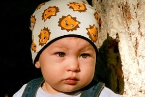 beaytiful child in a baby hat
