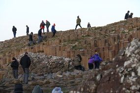 climbing tourists on stone stairs