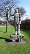 stone man statue in a park