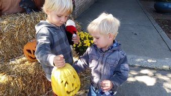 kids playing with pumpkin